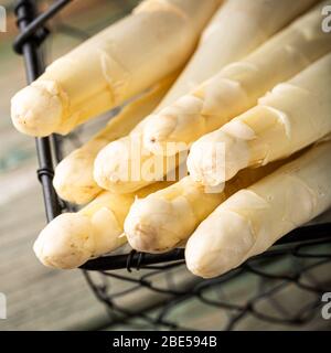 White asparagus on wooden table Stock Photo