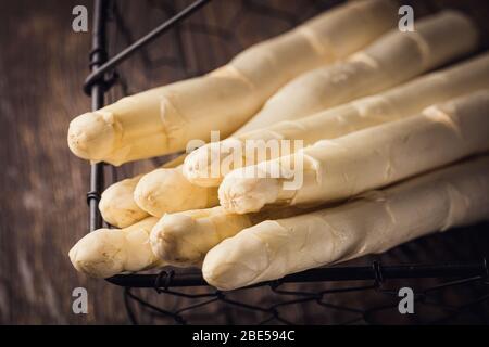 White asparagus on wooden table Stock Photo