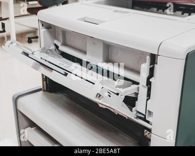Close up of manual paper feed slot in the laser jet printer often seen in the office and company Stock Photo