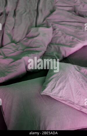 Morning bed on the bed, gray sheet, blanket and pillows Stock Photo