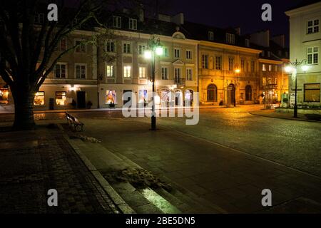New Town (Nowe Miasto) in Warsaw city at night in Poland, row of old tenement houses, empty square and cobblestone streets Stock Photo