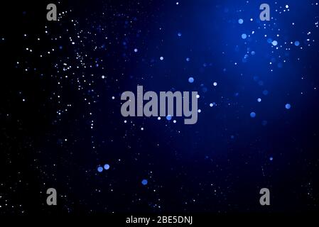 Abstract background with glowing blue particles. Stock Photo