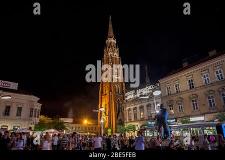OSIJEK, CROATIA - AUGUST 25, 2017: Crowd gathering at a food market on the main square of Osijek, Ante Starcevic square. The Cathedral of the city can Stock Photo
