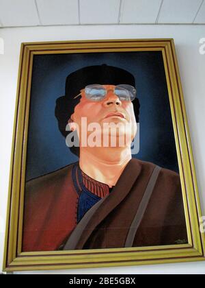 View to a poster on the wall with Libya’s former and now dead presidents figure, Muhammar Quaddafi Stock Photo