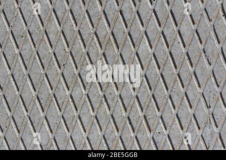 Concrete slab texture. Concrete slab Rhombic pattern on a concrete slab closeup. Stock Photo