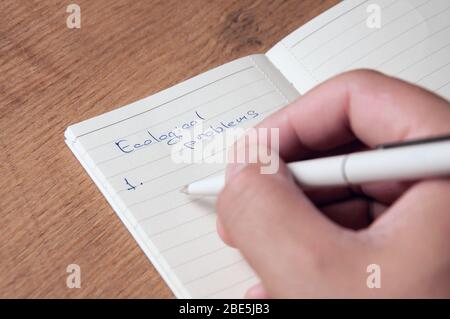 Notebook with pages in a cell. Blank page of open notebook Stock Photo