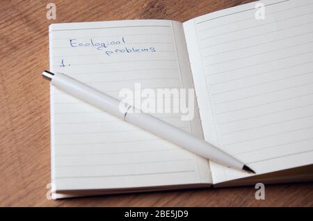 Notebook with pages in a cell. Blank page of open notebook Stock Photo