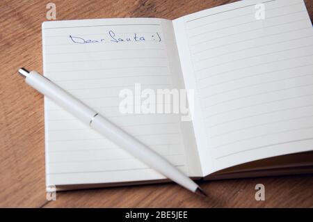 Notebook with pages in a cell. Blank page of open notebook Stock Photo