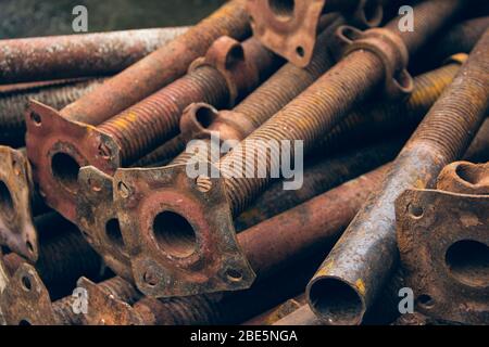 Pipes used for fastening wooden beams during the construction of concrete. Pipes supporting formwork. Metal supports for scaffolding and formwork. Thr Stock Photo