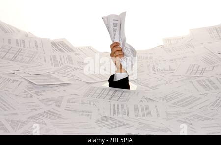 Stress durch zuviel Buerokratie, Mann erstickt in Papier, Insolvenz, Pleite, MR: Yes Stock Photo