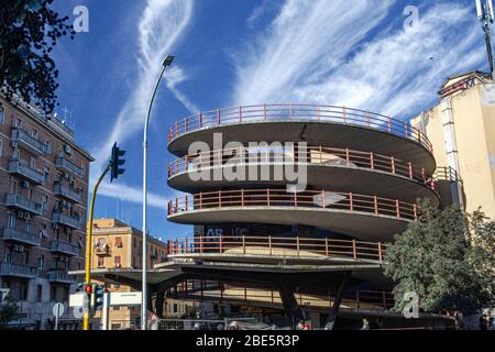 Rome, Italy, 25.12.2019: multi-level car parking in the city centre, parking in the center of Rome, blue cloudy sky Stock Photo