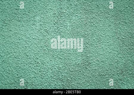 Green painted concrete wall. Texture of plaster, stucco. Grunge stone background, whitewash wallpaper Stock Photo