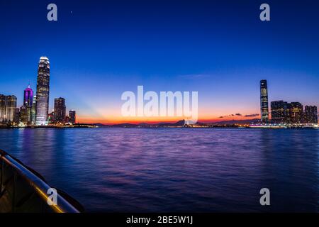 City view of Victoria Harbour of Hong Kong at Magic Hour Stock Photo