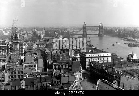 A view of the Pool of London, The Tower and Tower Bridge taken from The Monument in the 1930s, possibly during the war. Stock Photo