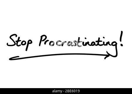 Stop Procrastinating! handwritten on a white background. Stock Photo