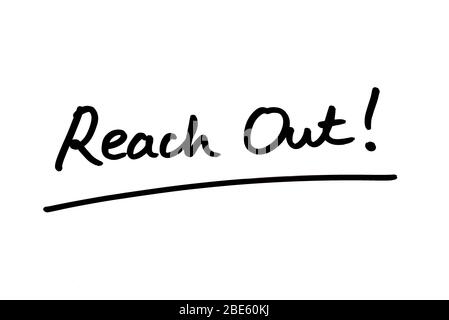 Reach Out! handwritten on a white background. Stock Photo