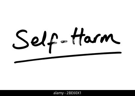 Self-Harm handwritten on a white background. Stock Photo