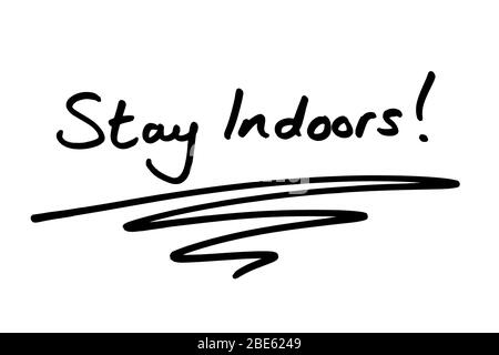 Stay Indoors! handwritten on a white background. Stock Photo