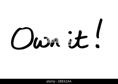 Own it! handwritten on a white background. Stock Photo
