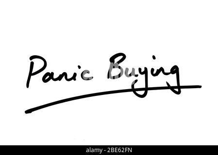 Panic Buying handwritten on a white background. Stock Photo