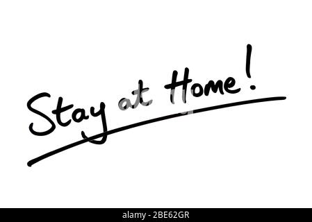 Stay at Home! handwritten on a white background. Stock Photo