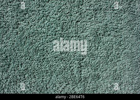 Close-up of soft cotton turquoise towel texture. Fabric bath towel background. Stock Photo