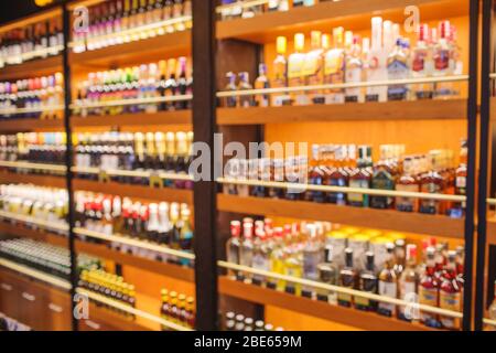 Background Blurred Defocused Beers are cooling in fridge, freezer or refrigerator shelf. Defocused Blurry Night life, Night Club, Bar, Pub, Store or G Stock Photo