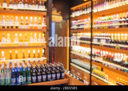 Background Blurred Defocused Beers are cooling in fridge, freezer or refrigerator shelf. Defocused Blurry Night life, Night Club, Bar, Pub, Store or G Stock Photo