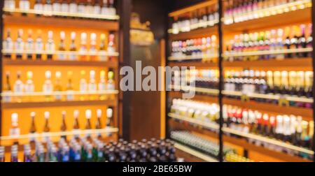 Background Blurred Defocused Beers are cooling in fridge, freezer or refrigerator shelf. Defocused Blurry Night life, Night Club, Bar, Pub, Store or G Stock Photo