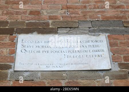 Pieve (rural parish Church) of San Donato in Polenta. Bertinoro, Italy. Facade detail – epigraph. Stock Photo