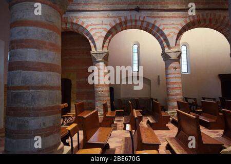 Pieve (rural parish Church) of San Donato in Polenta. Bertinoro, Italy. Basilica Interior. Slanted columns detail. Stock Photo