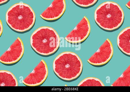 Seamless pattern with fruits. Tropical abstract blue background with kiwi and greapfruit with copyspace Stock Photo