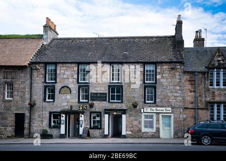 Exterior of the Bruce Hotel, a former 15th-century ale house opposite the fabulous historic Royal Palace of Falkland, Falkland, Fife, Scotland, UK, Eu Stock Photo