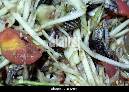 som tam pla ra seafood thai dish salad macro vegetables Stock Photo