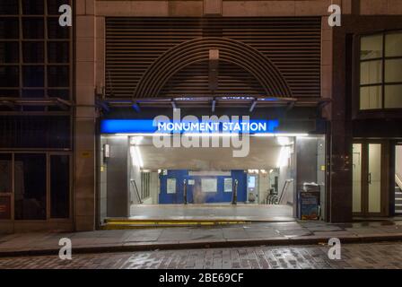 Night Dark Lights Illuminated London Underground Monument Station King William St, Candlewick, London EC4R 9AA Stock Photo