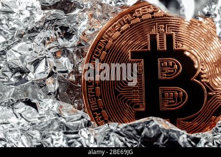 Bitcoin on silver background. Halving cryptocurrency. The crisis in the economy. Stock Photo