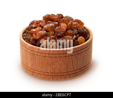 Raisins in wooden bowl isolated on white background Stock Photo