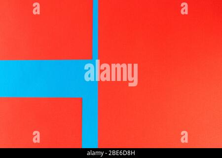 Pattern of bright red and blue pieces of paper, with clear angles and geometry Stock Photo