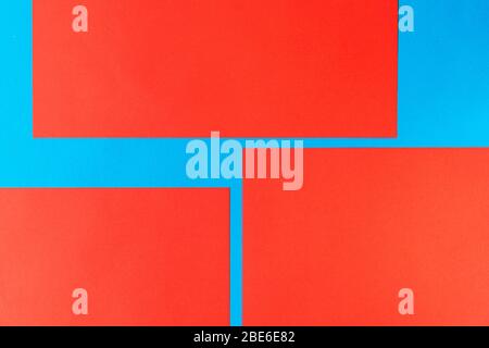 Pattern of bright red and blue pieces of paper, with clear angles and geometry Stock Photo
