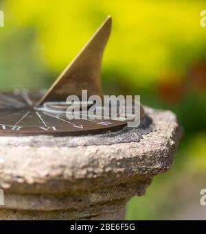 Close up of sundial on a stone plinth Stock Photo