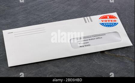 Envelope containing voting ballot papers being sent by mail for absentee vote in presidential election Stock Photo