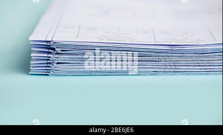 Stack Folding drawings on a blue background. Copy space. Stock Photo