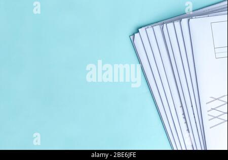 Stack Folding drawings on a blue background. Top view. Flat lay. Stock Photo