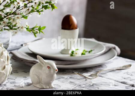 Decorated Easter table with blooming cherry plum. Stock Photo