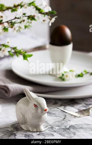 Decorated Easter table with blooming cherry plum. Stock Photo