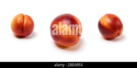 three ripe nectarines on a white background, isolated with a shadow Stock Photo