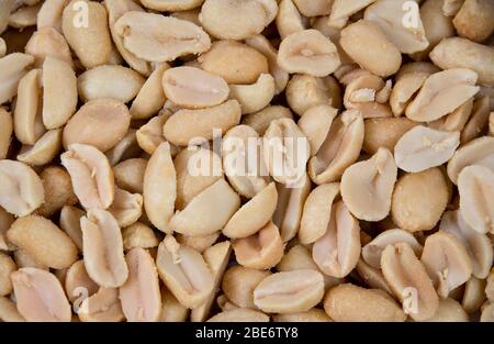 Salted and roasted peanuts background Stock Photo