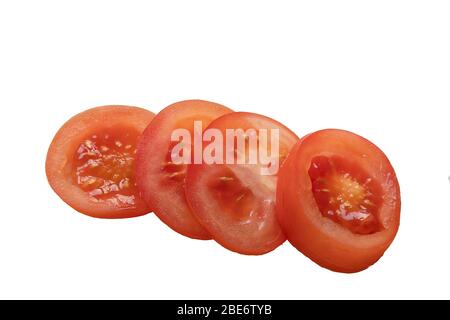 Sliced salad tomato isolated on a white background Stock Photo