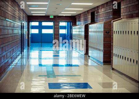 a high school hallway / that has nobody in it / but will soon enough Stock Photo