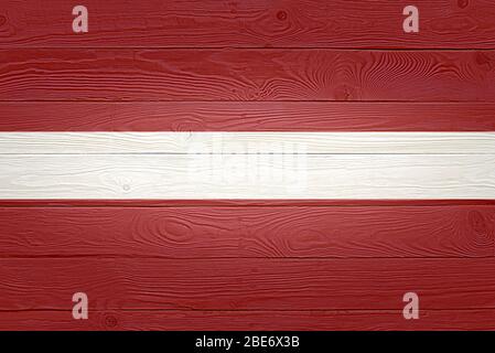 Latvia flag on wooden planks background wood flag Stock Photo - Alamy